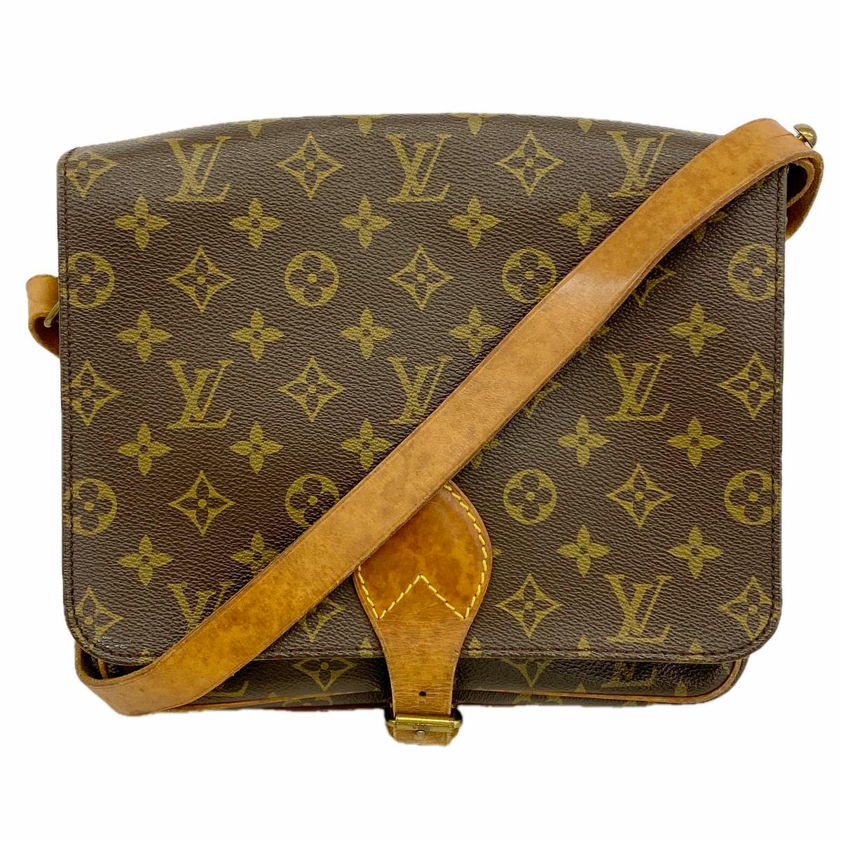 Front view of the Louis Vuitton monogram Cartouchiere GM shoulder bag with brown leather strap.