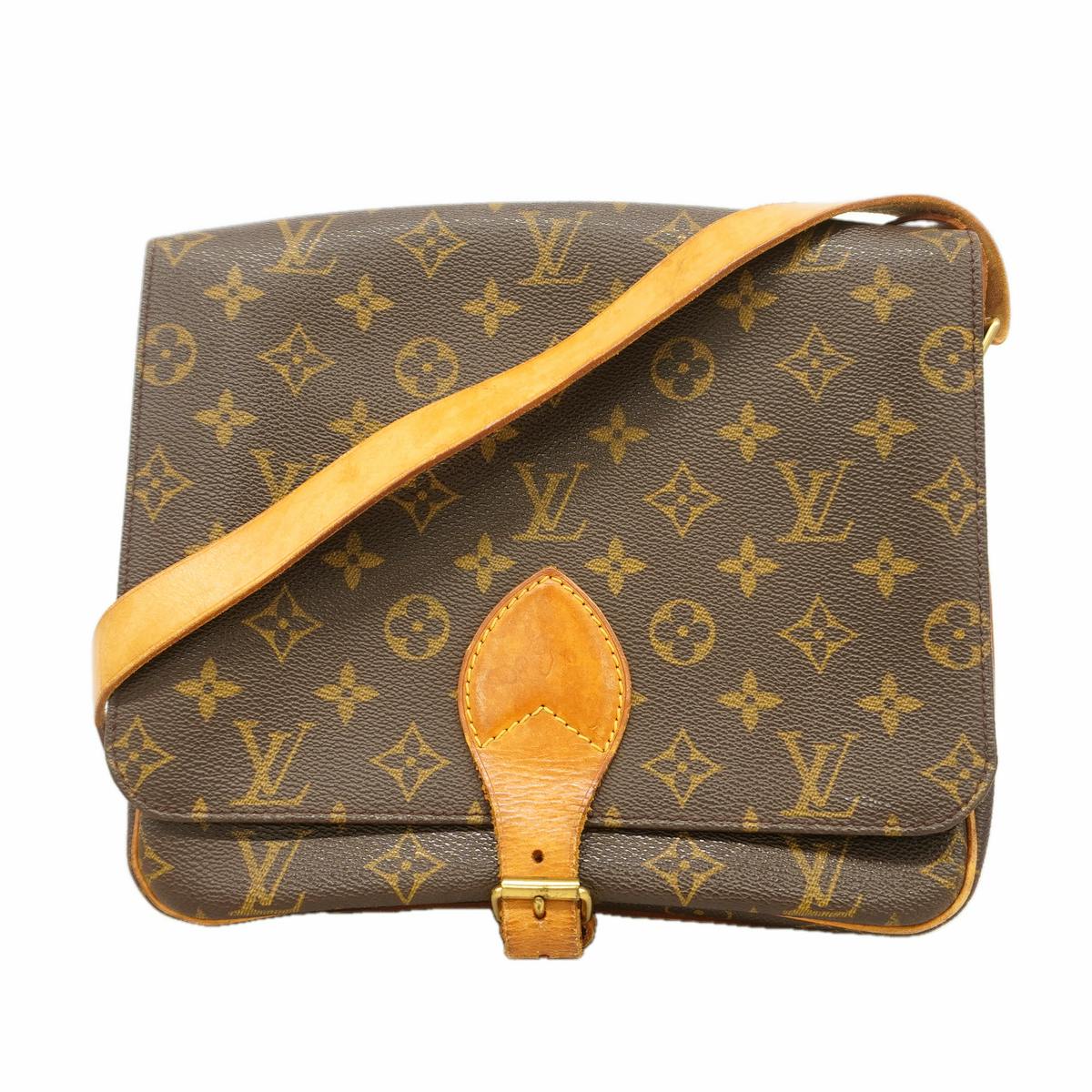 Front view of the Louis Vuitton monogram canvas shoulder bag with a tan leather strap and buckle detail.