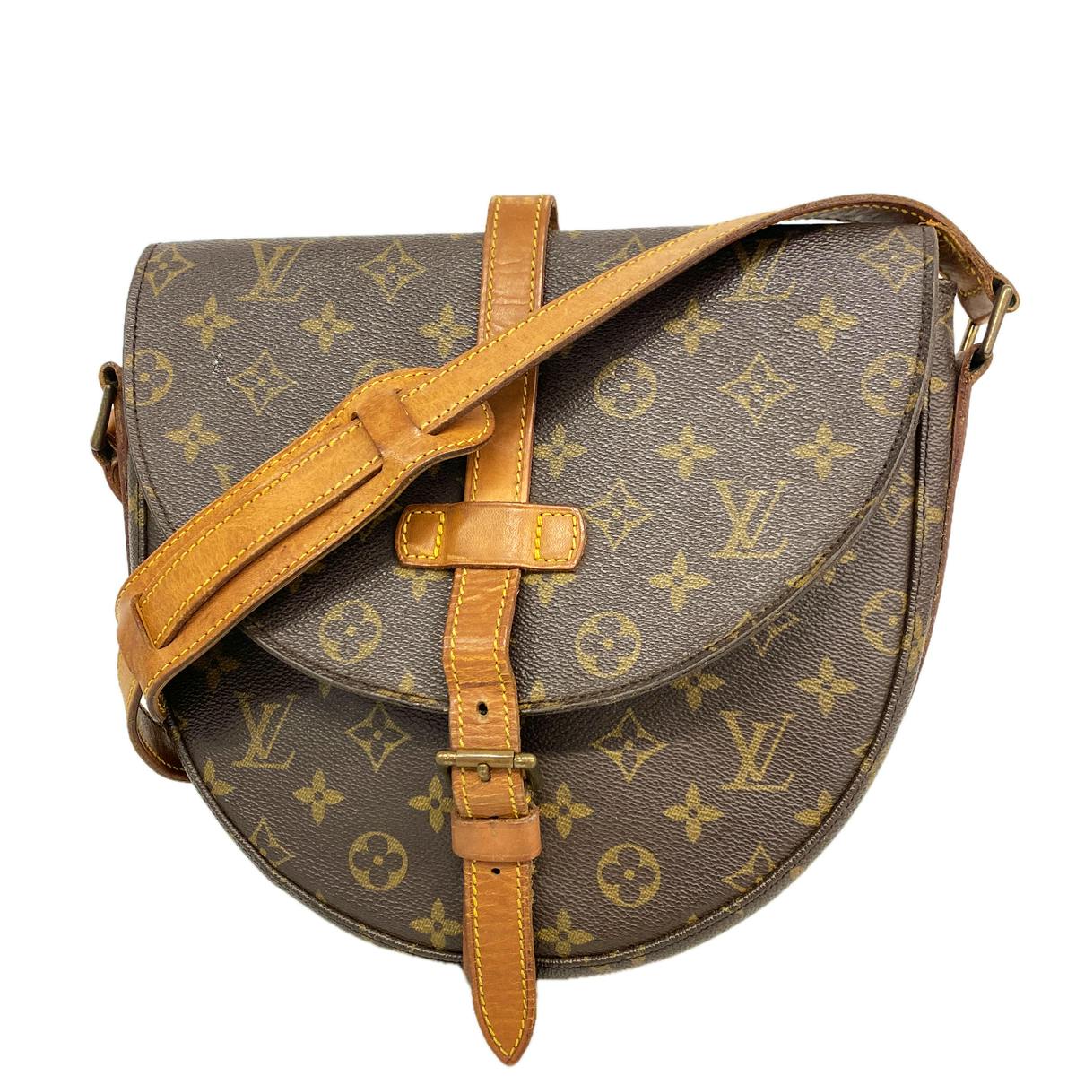 Front view of a brown Louis Vuitton Monogram shoulder bag (Chantilly GM) showing monogram canvas, leather strap, and front buckle.