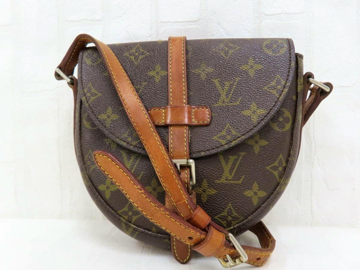 Front view of the Louis Vuitton brown monogram shoulder bag with leather strap and gold-tone hardware.