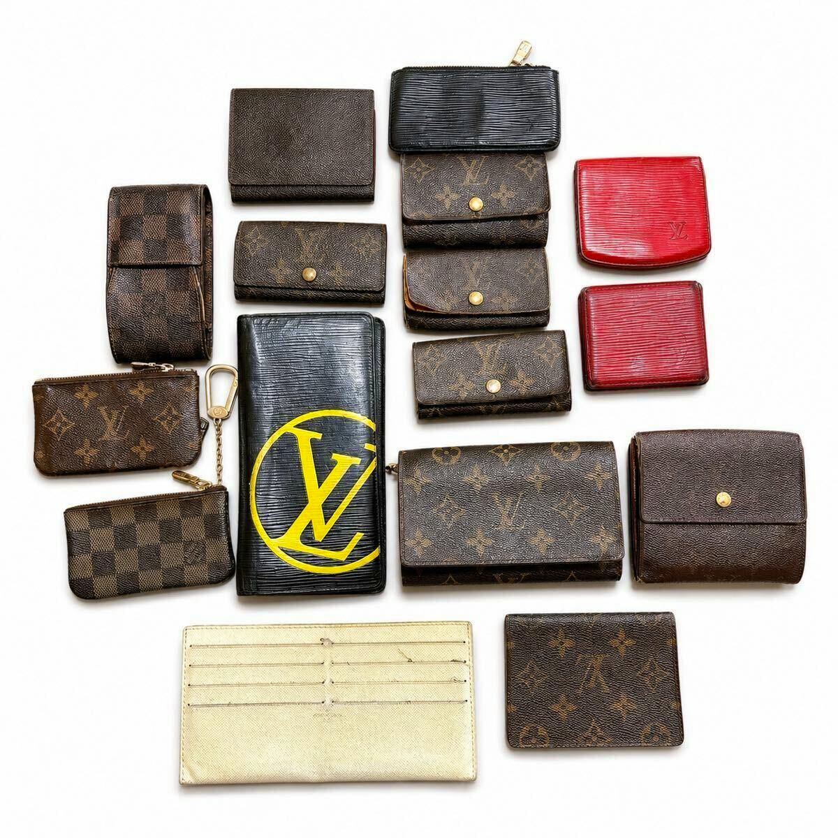 Flat-lay photo of the 16-piece Louis Vuitton lot showing wallets and small leather goods in monogram, Damier, and Épi patterns on a white background.