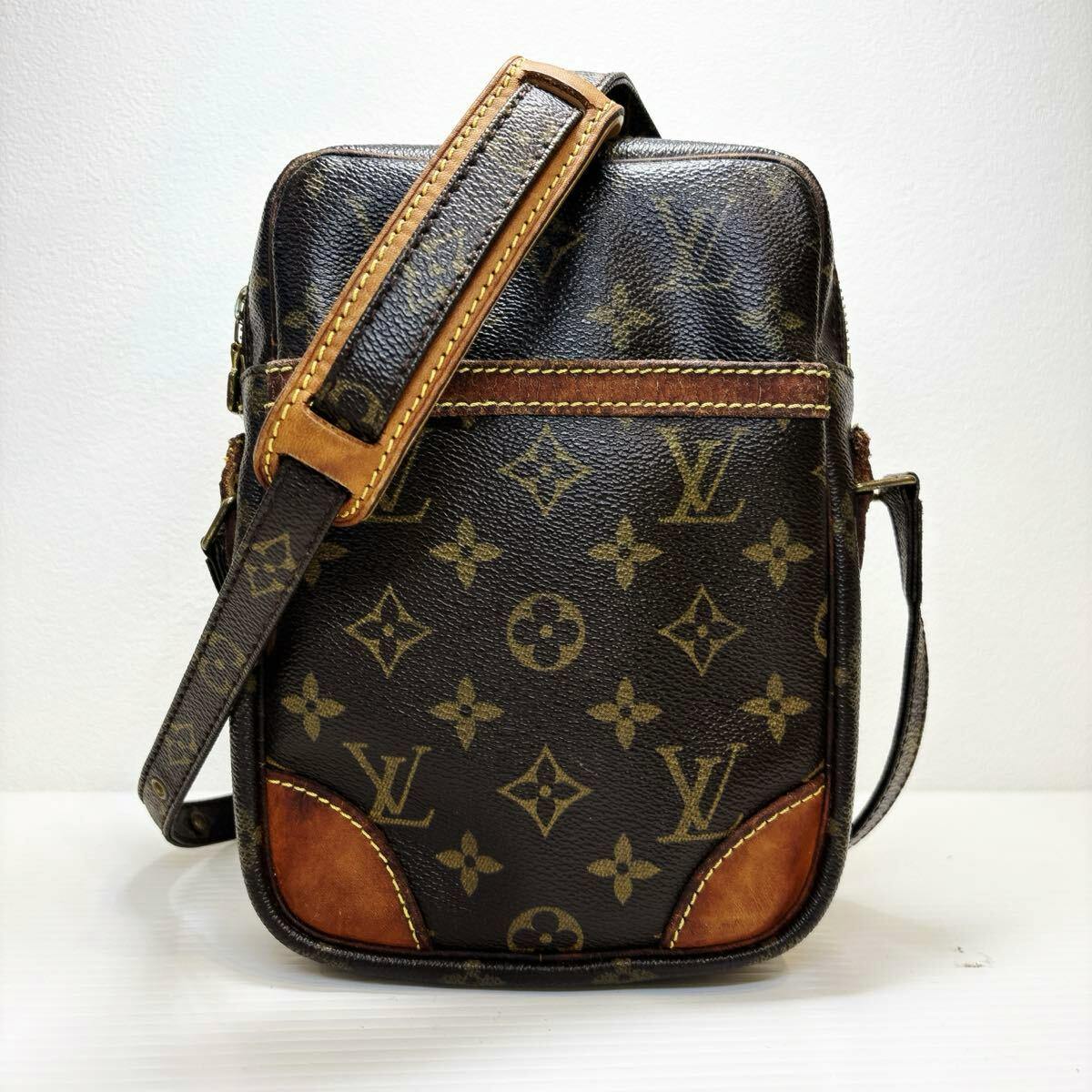 Front view of the LOUIS VUITTON monogram canvas bag with shoulder strap and leather trim.