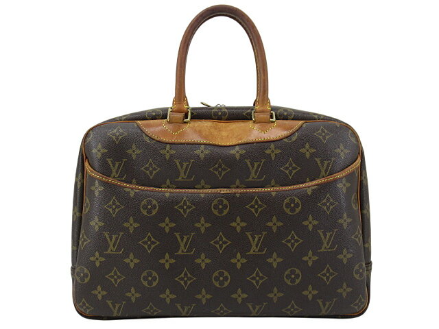 Brown Louis Vuitton monogram bowling/vanity handbag with double top handles on a white background.