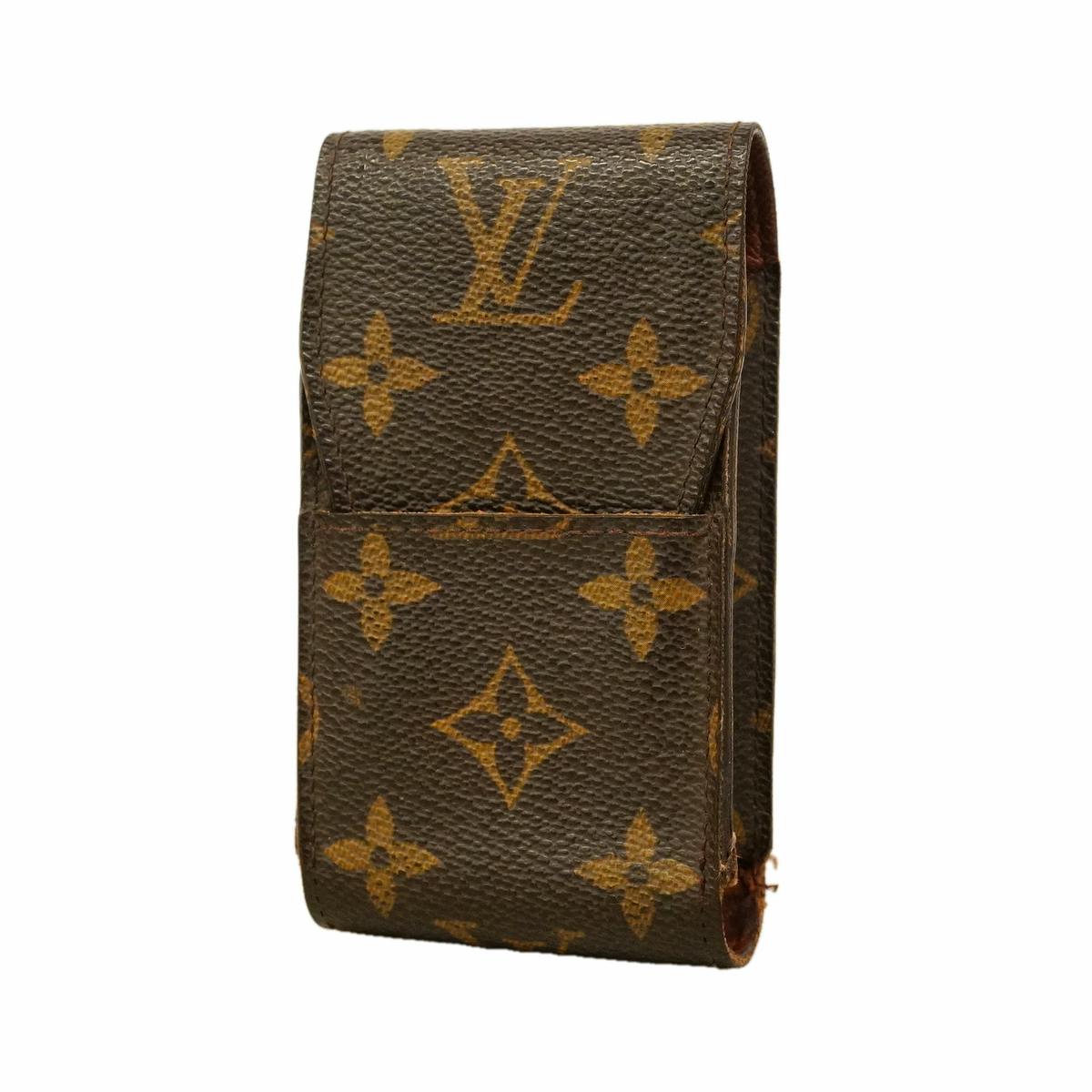 Brown Louis Vuitton monogram cigarette case showing the front and side with the flap closed.