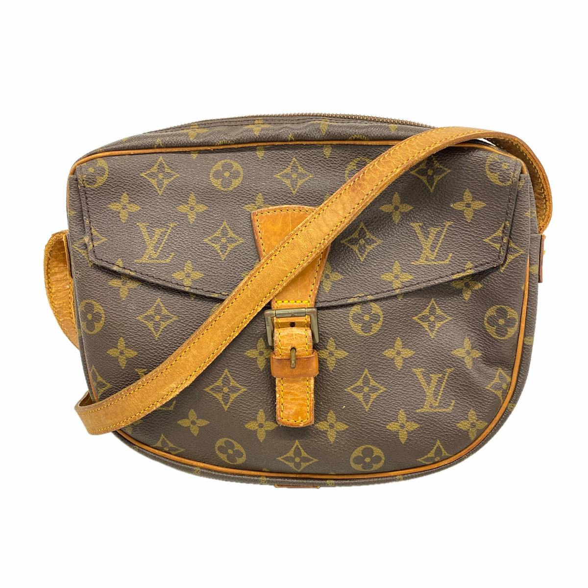 Front view of the Louis Vuitton brown monogram shoulder bag showing the flap, leather strap, and buckle.