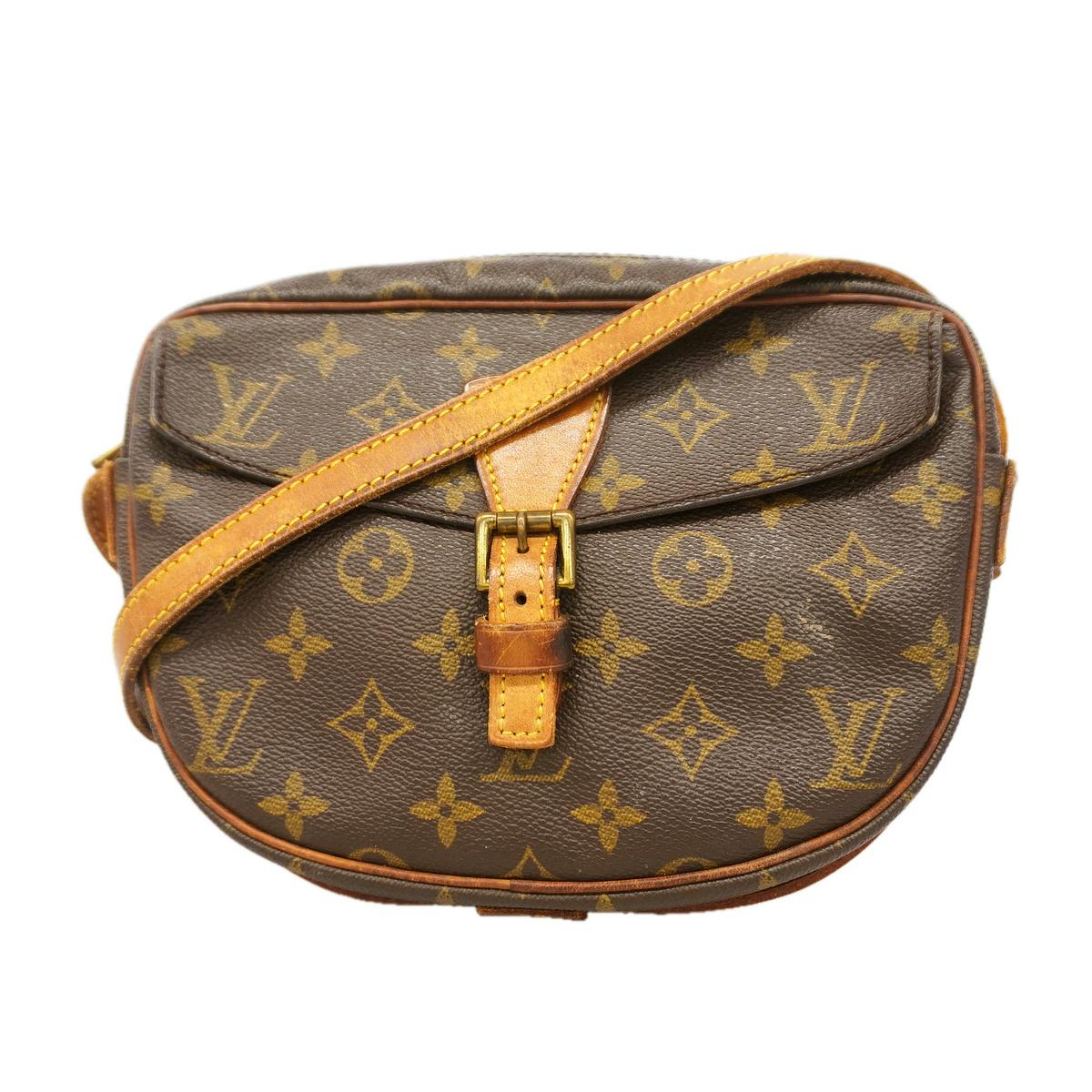 Front view of a brown Louis Vuitton Monogram Jeune Fille PM shoulder bag with leather strap and buckle.