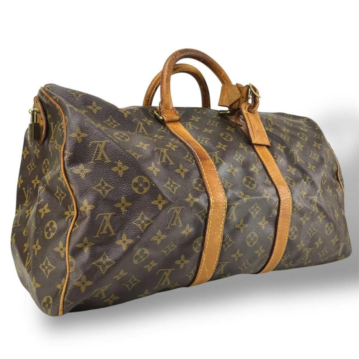 Front-side view of the Louis Vuitton Monogram キーポル45 (M41428) canvas Boston bag showing leather handles, straps, and attached name tag.