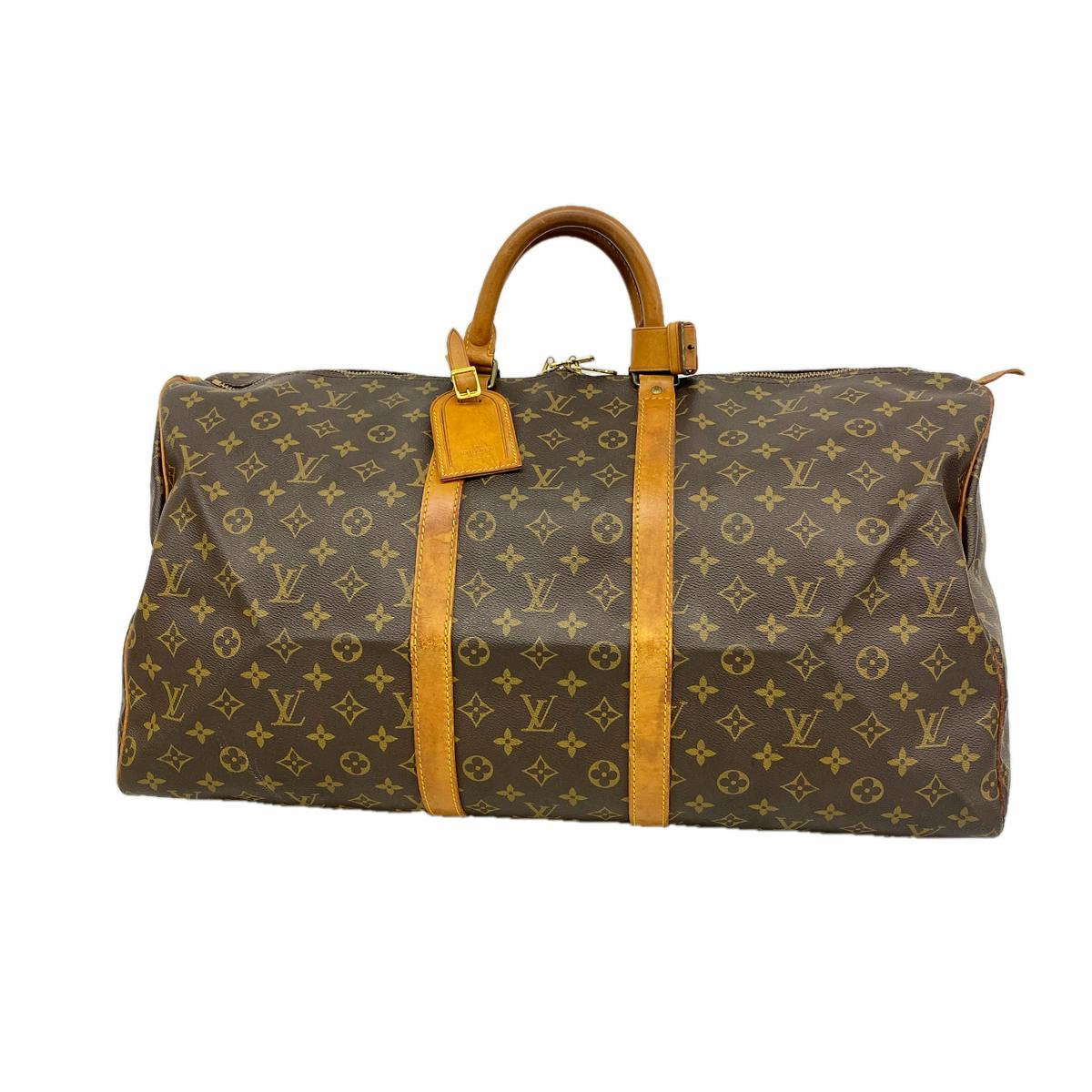 Brown Louis Vuitton monogram boston bag Keypol55 (M41424) with leather handles and straps on a white background.