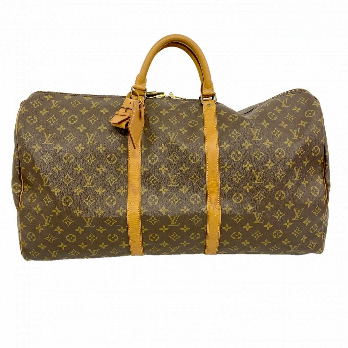 Front view of the Louis Vuitton monogram Keypol/Keepall 60 (M41422) brown duffel bag with leather handles and straps.