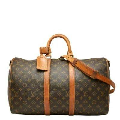 Brown Louis Vuitton Monogram Keepall Bandouliere 45 duffel bag with leather handles and shoulder strap.