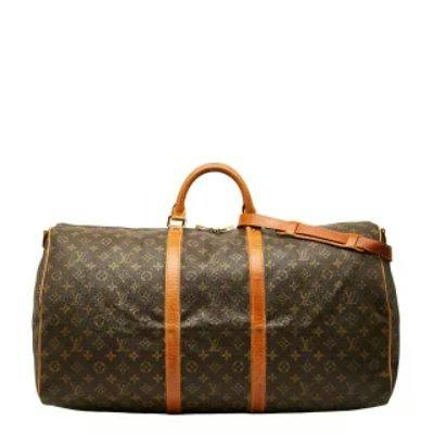 Brown Louis Vuitton Monogram Keepall Bandoulière 60 duffle bag with leather handles and shoulder strap visible.