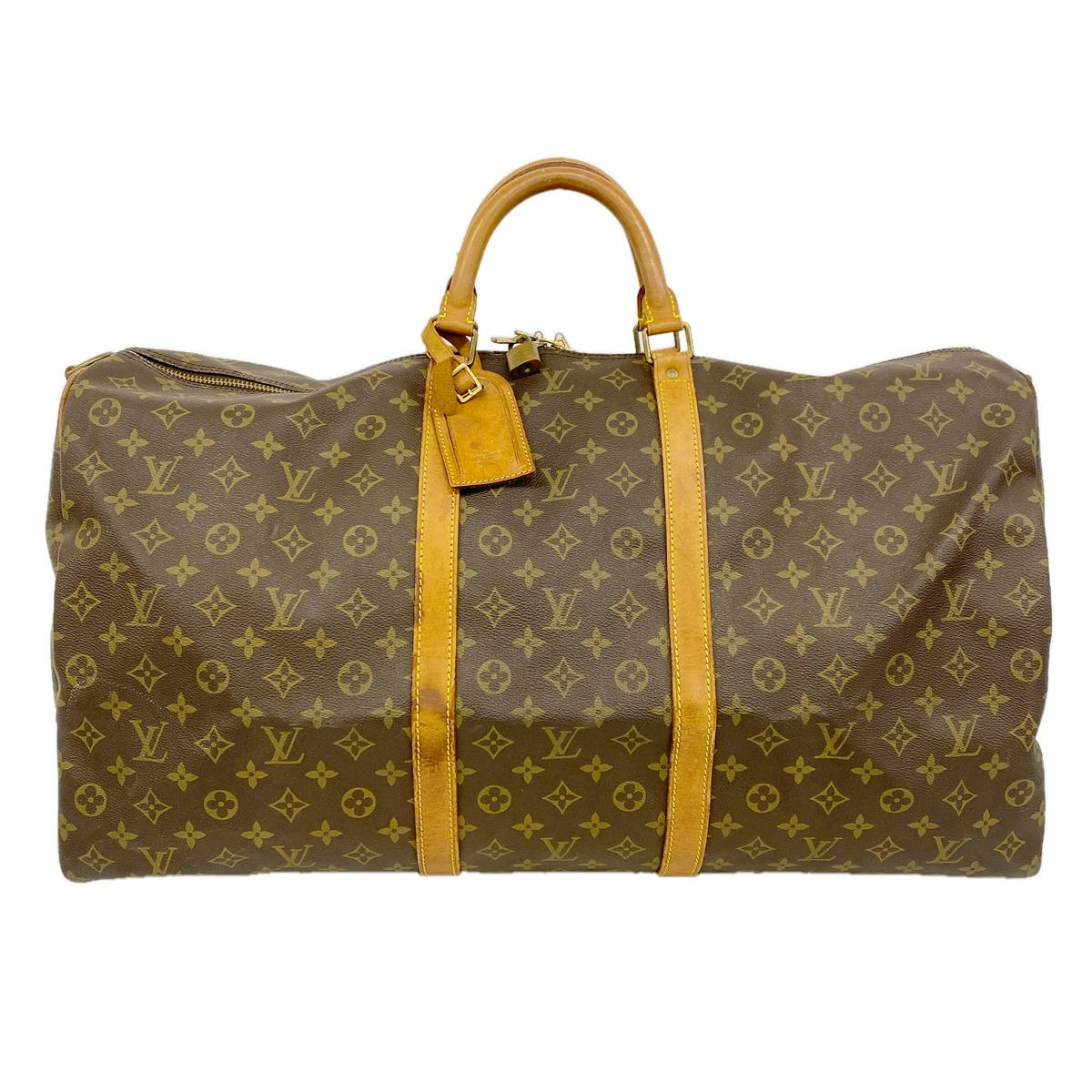 Front view of a brown Louis Vuitton monogram Keepall Bandouliere 60 bag with leather handles and straps.