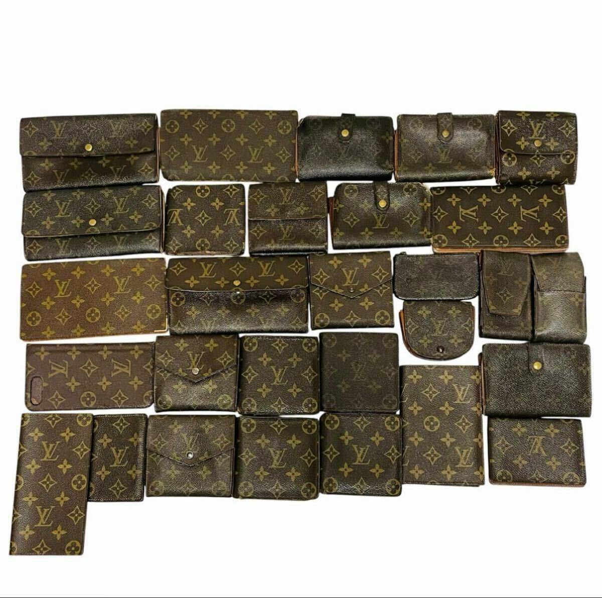 Multiple Louis Vuitton monogram leather wallets and small accessories arranged on a white background.