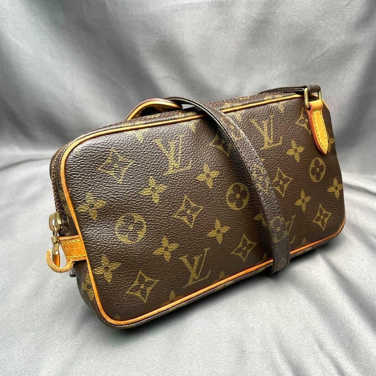 Diagonal front view of the Louis Vuitton Monogram Marly Bandoulière shoulder bag (M51828) showing monogram canvas, leather piping, and strap.