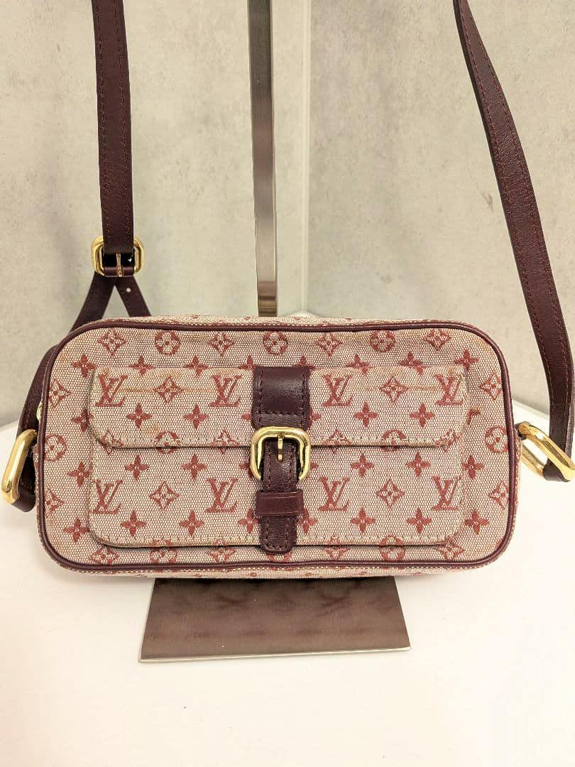 Front view of the Louis Vuitton Monogram Mini Juliette MM bag showing the monogram canvas, front buckle pocket, and shoulder strap.