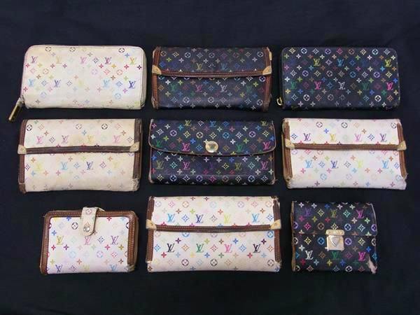Nine Louis Vuitton Monogram Multicolore wallets arranged in three rows on a black background.