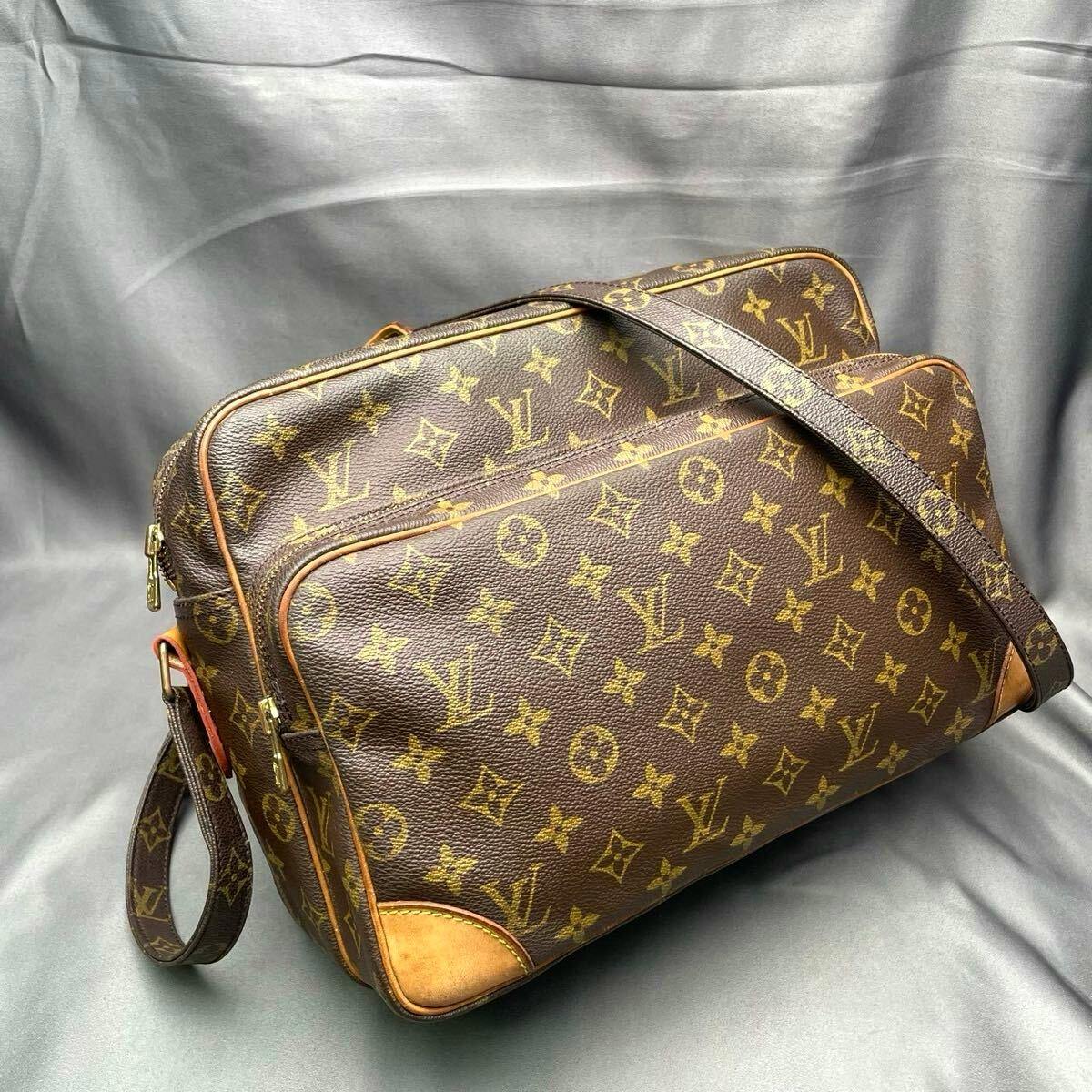Louis Vuitton Monogram Nile GM shoulder/crossbody bag (M27852) shown on a gray backdrop.