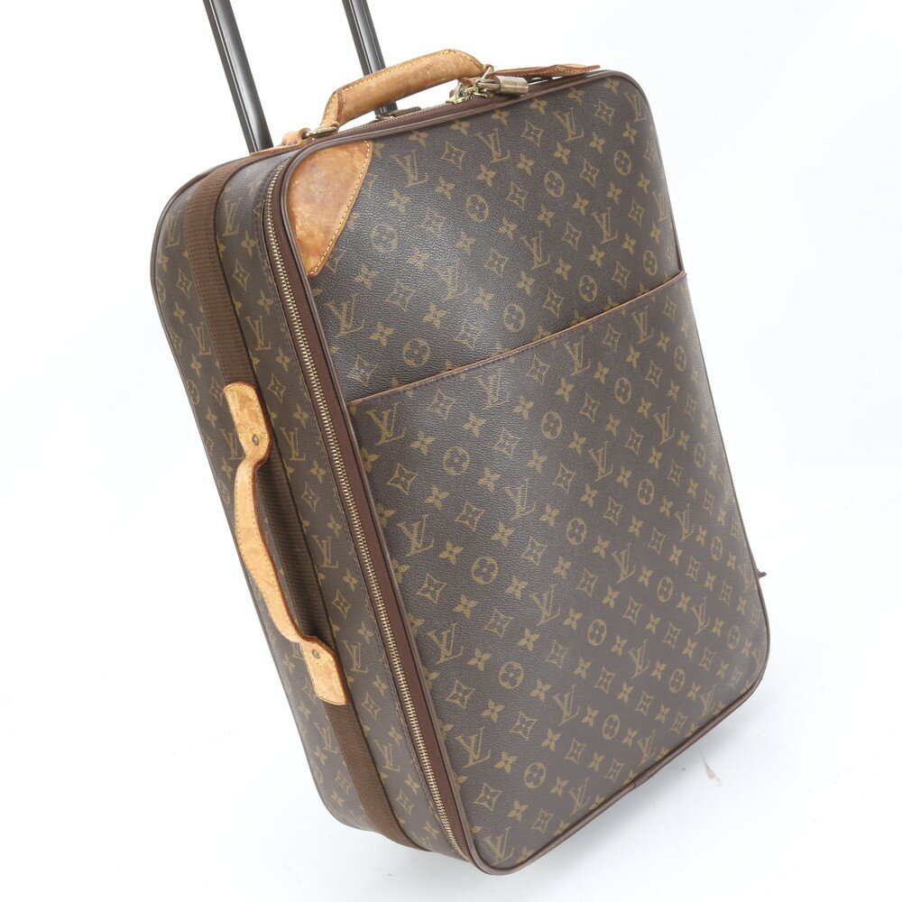 Monogram Pegase 55 cow leather suitcase shown in an angled front view with the telescopic handle partially extended.