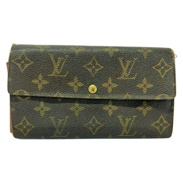 Front view of a Louis Vuitton monogram long wallet with flap and snap closure.