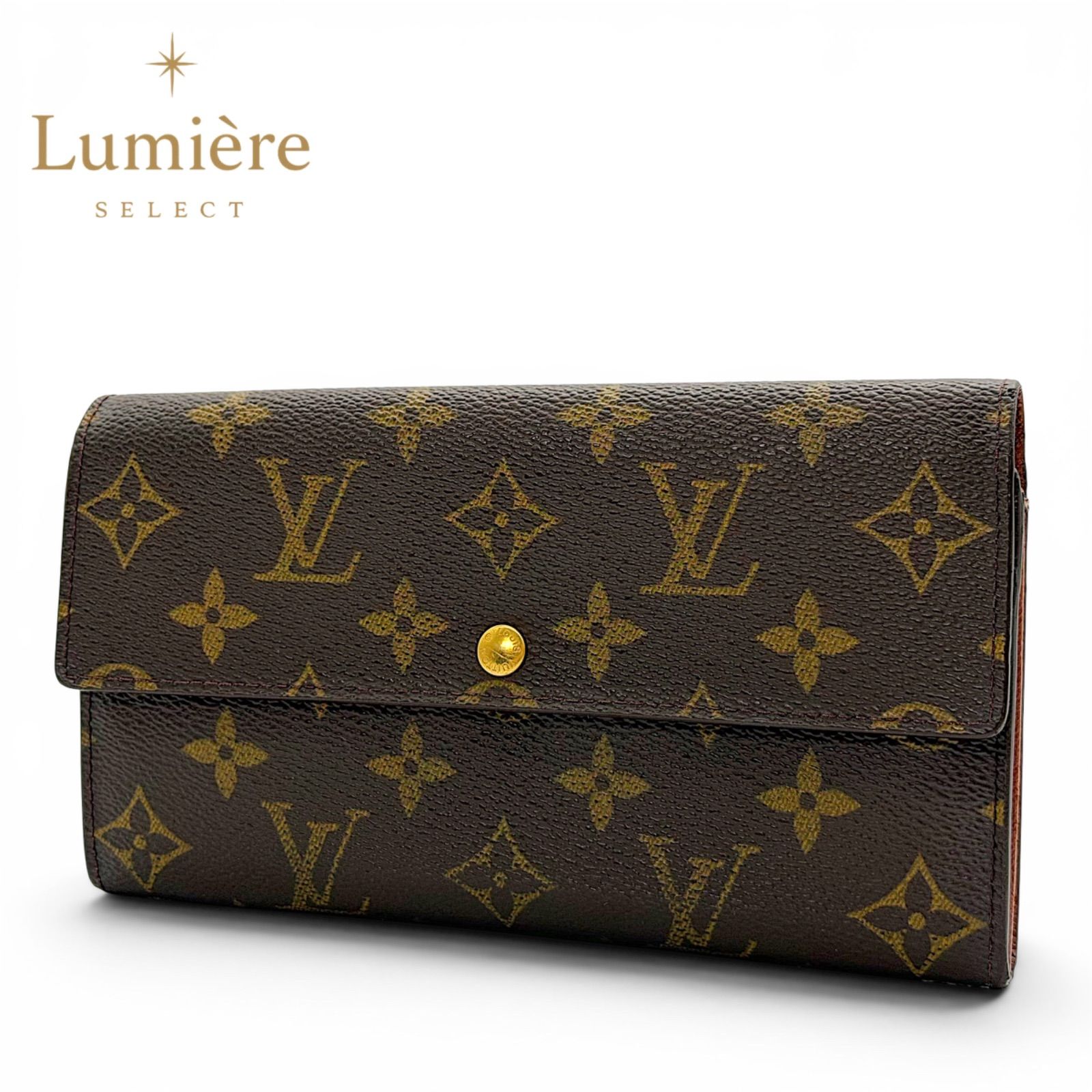 Brown Louis Vuitton monogram wallet with flap and gold snap button, shown closed.