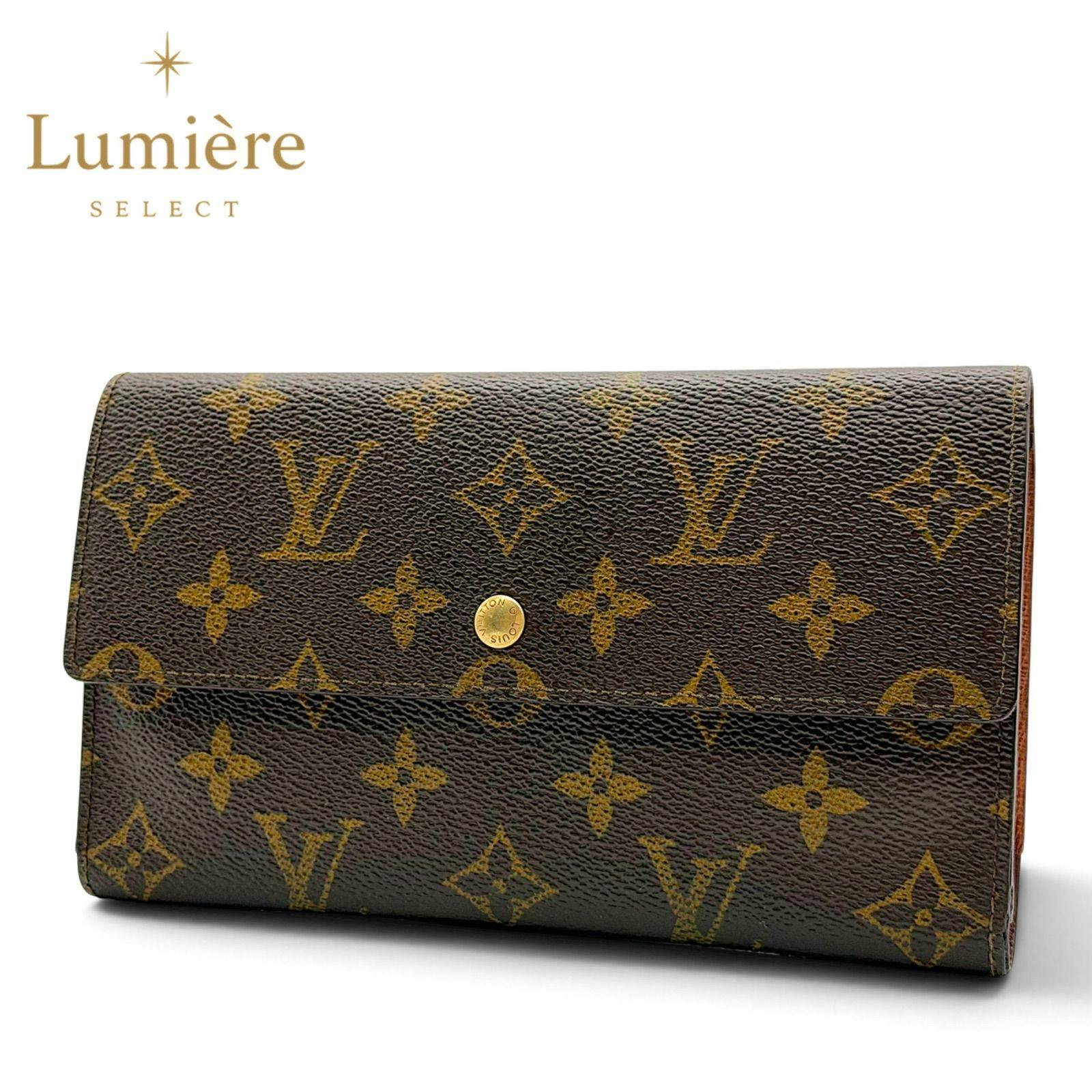 Front exterior of a brown Louis Vuitton monogram long trifold wallet showing the flap and gold snap button against a white background.
