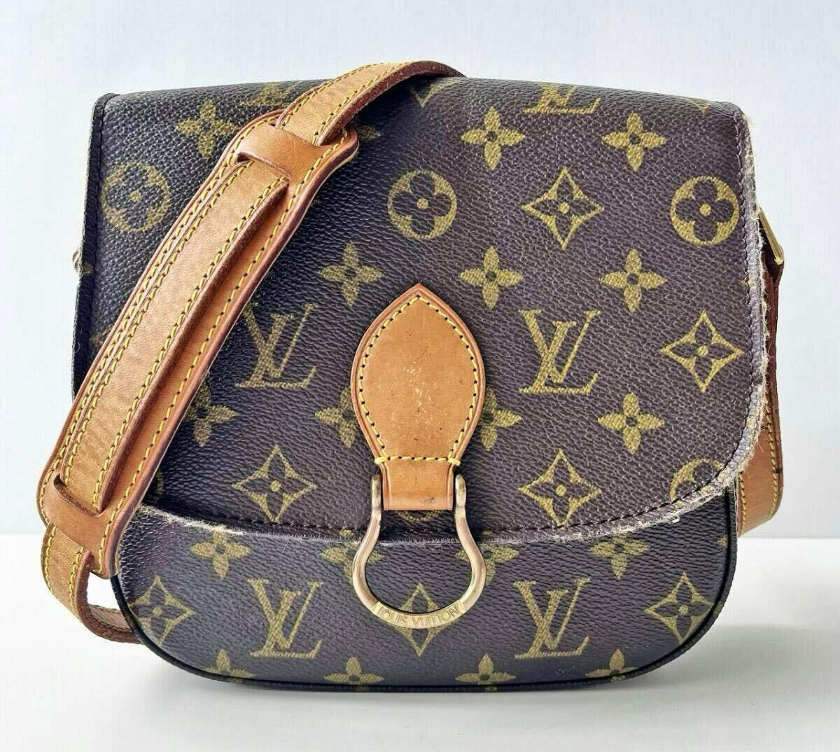Front view of a Louis Vuitton monogram shoulder bag with leather strap and metal clasp visible.