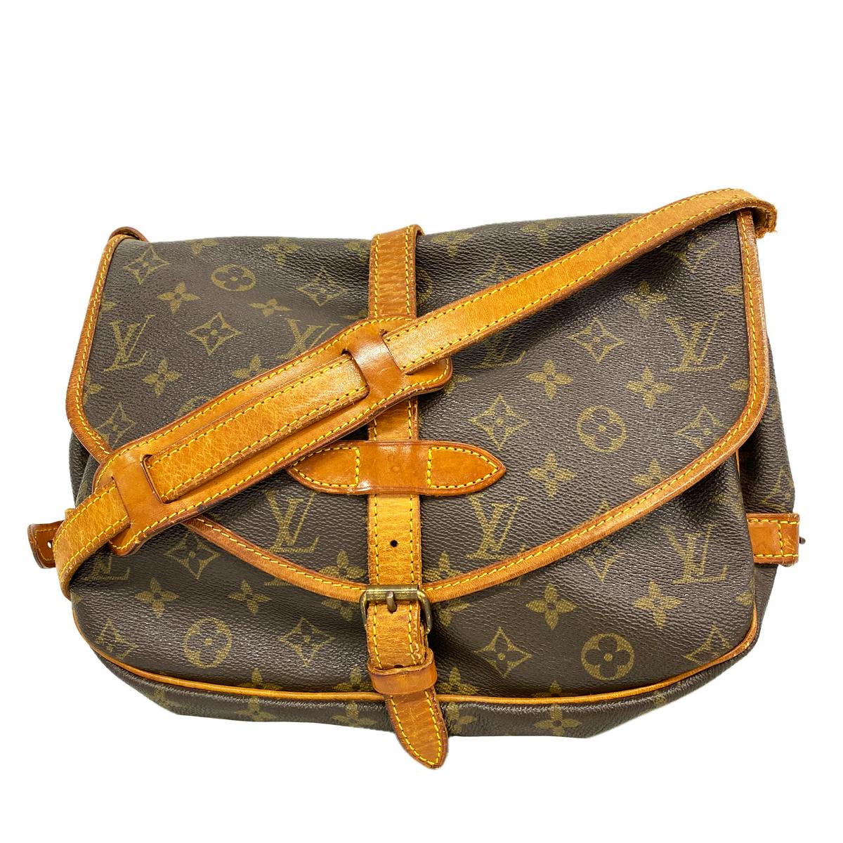 Front view of the Louis Vuitton monogram canvas Sommeur 30 shoulder bag with leather trim and adjustable strap.