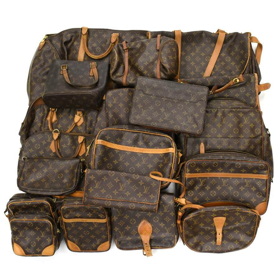 Multiple Louis Vuitton monogram shoulder, hand, and small bags arranged together, shown from above.