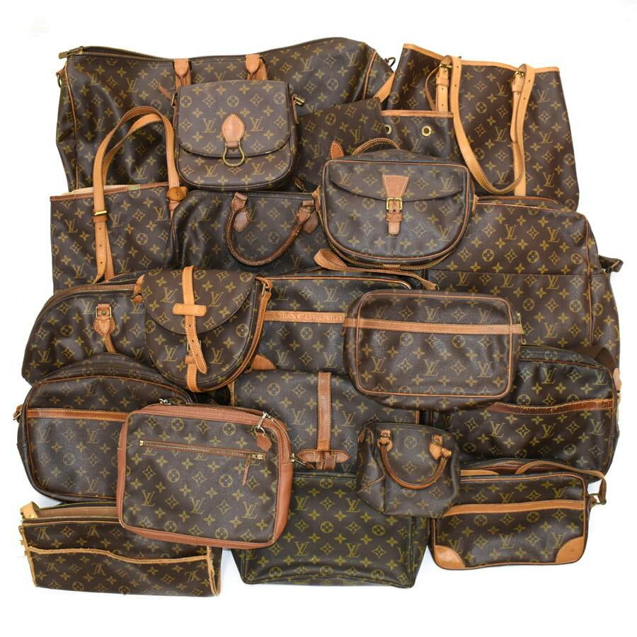 Multiple Louis Vuitton monogram shoulder and hand bags arranged together against a white background.