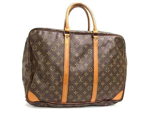 Front view of a Louis Vuitton monogram canvas Sirius 45 handbag with leather handles and trim.