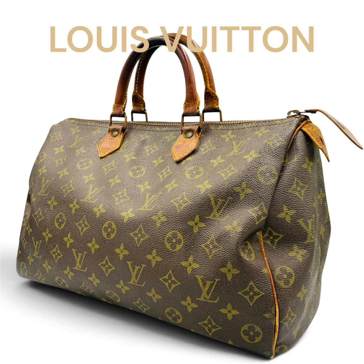 Louis Vuitton Monogram Speedy 35 canvas duffel bag with leather handles shown at an angle.