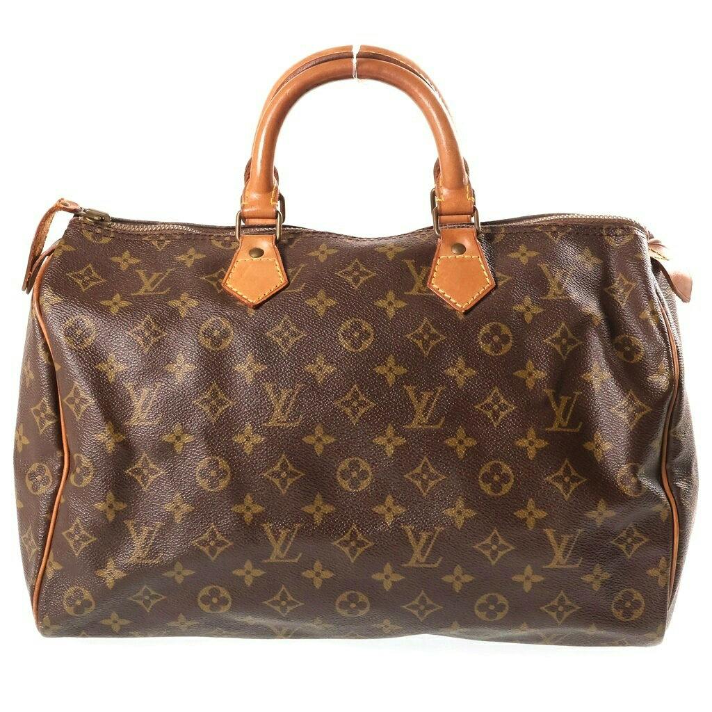 Front view of the Louis Vuitton monogram Speedy 35 bag showing the monogram canvas body and cow leather handles.