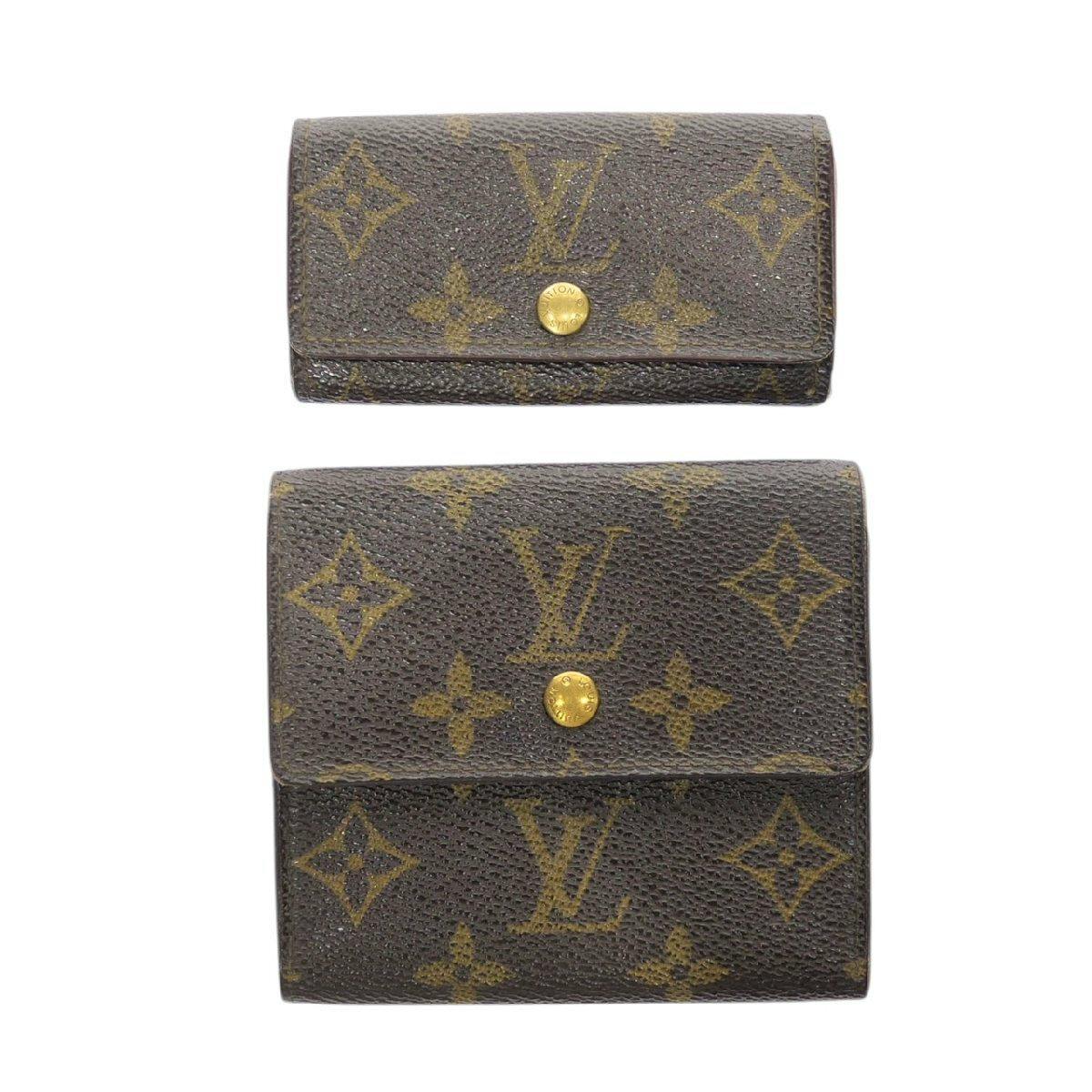 Front view of two Louis Vuitton monogram canvas small goods (a tri-fold wallet and a key case) in brown with gold snap buttons.