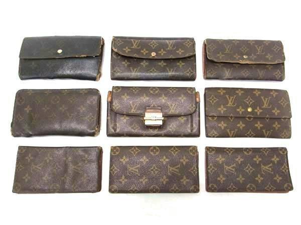 Nine LOUIS VUITTON monogram canvas wallets arranged on a white background.