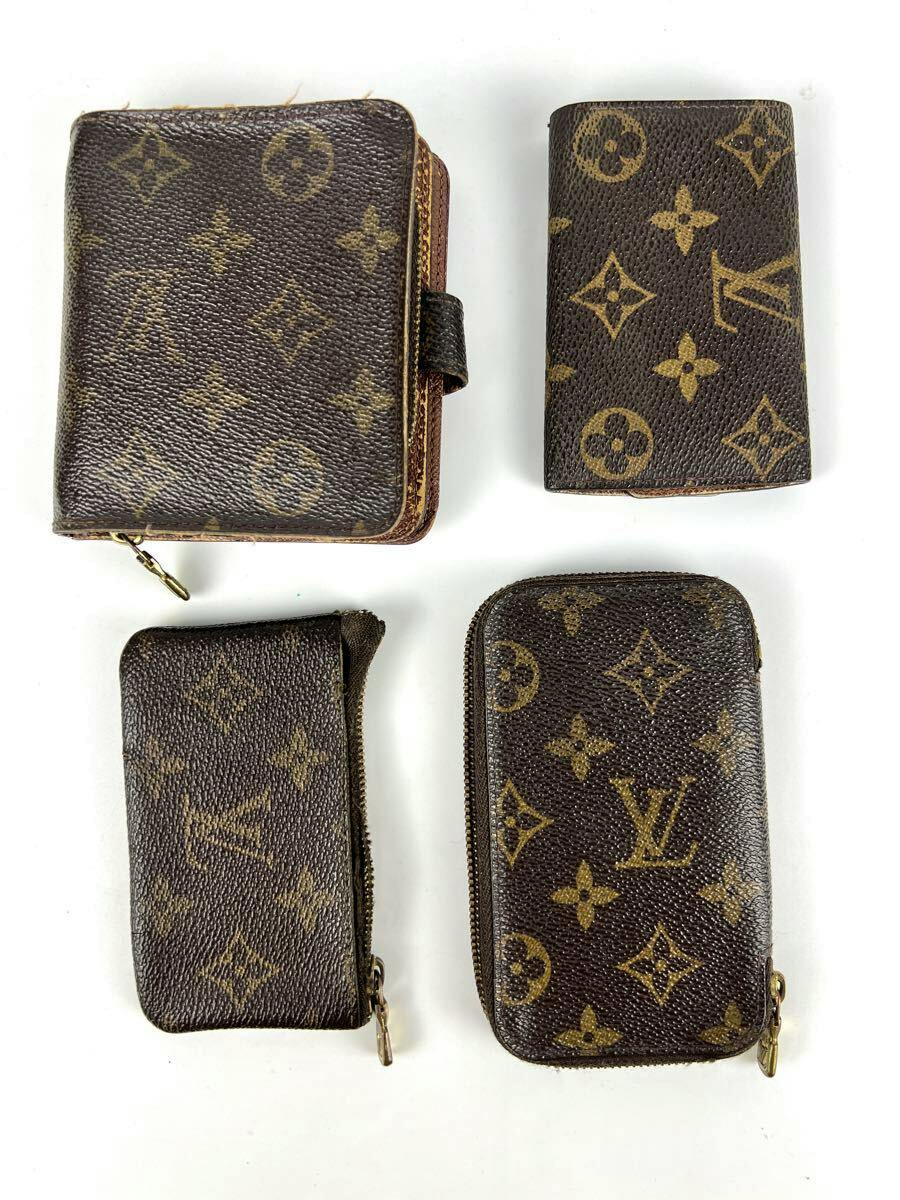 Four Louis Vuitton monogram small leather items (wallet, card case, and two zippered pouches) arranged on a white background.