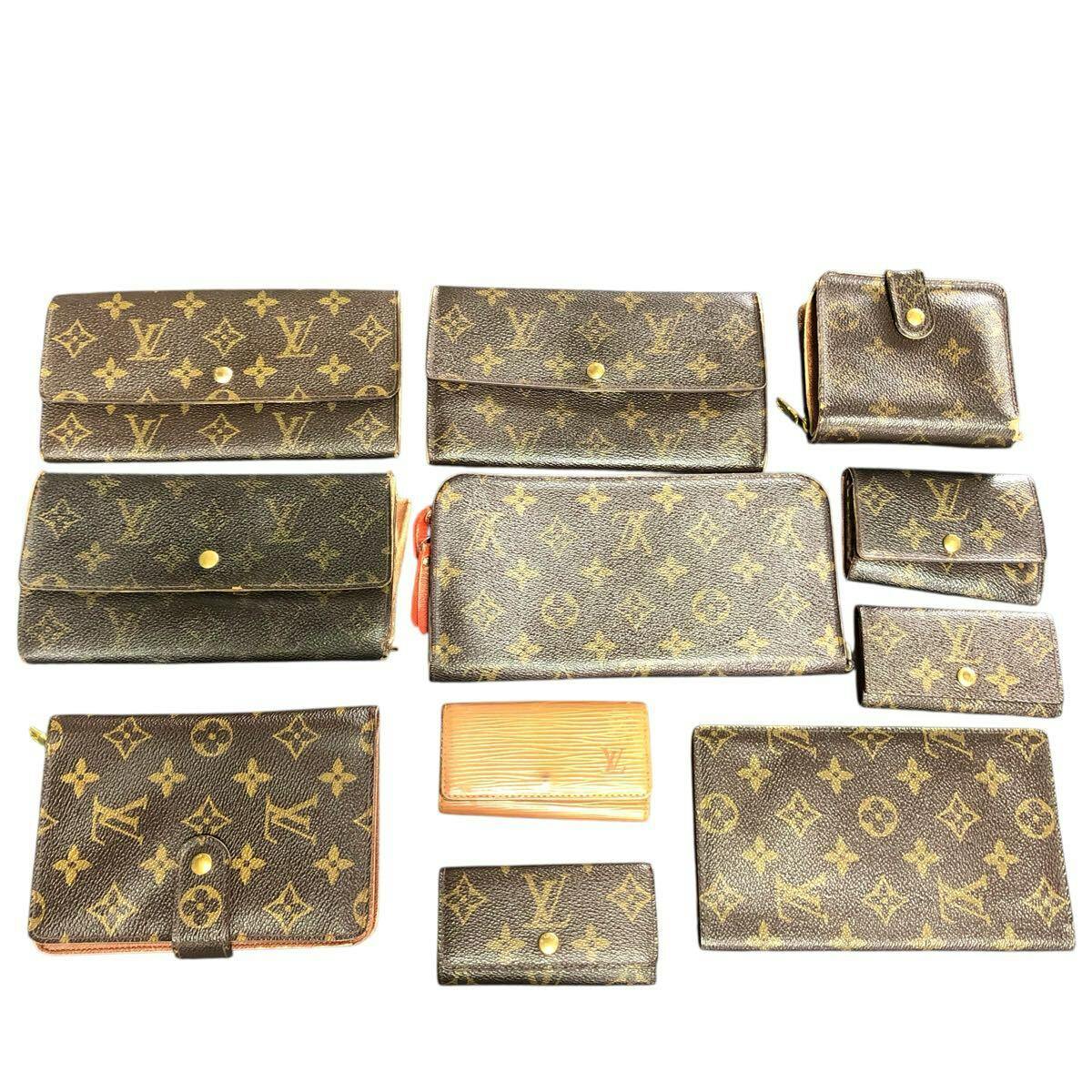 A set of Louis Vuitton monogram wallets and small cases arranged on a white background.