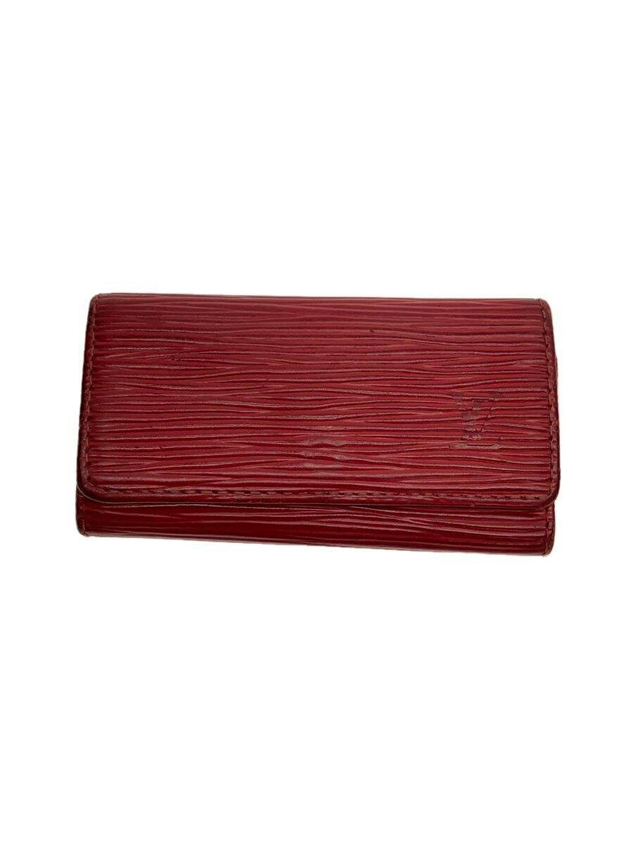 Closed red textured leather Louis Vuitton Multiclés 6 key holder shown against a white background.