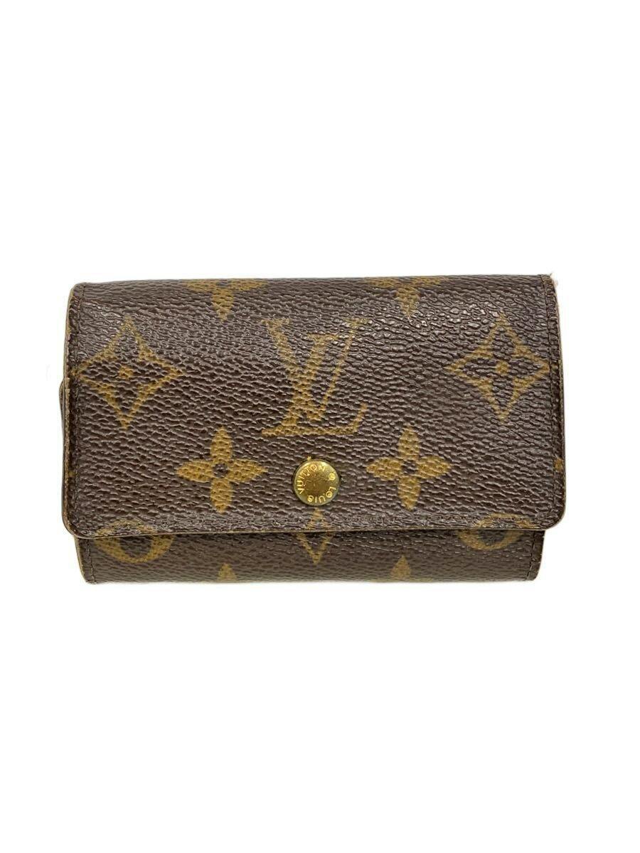 Brown Louis Vuitton monogram cow leather wallet with a gold snap button closure shown from the front.