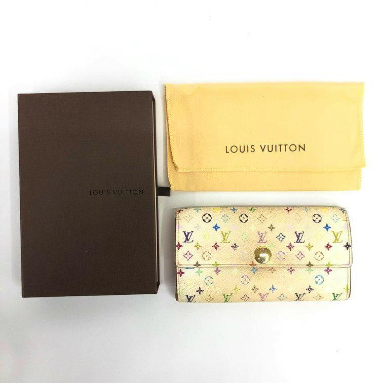 A Louis Vuitton multicolor canvas wallet shown alongside its brown box and yellow dust bag on a white background.