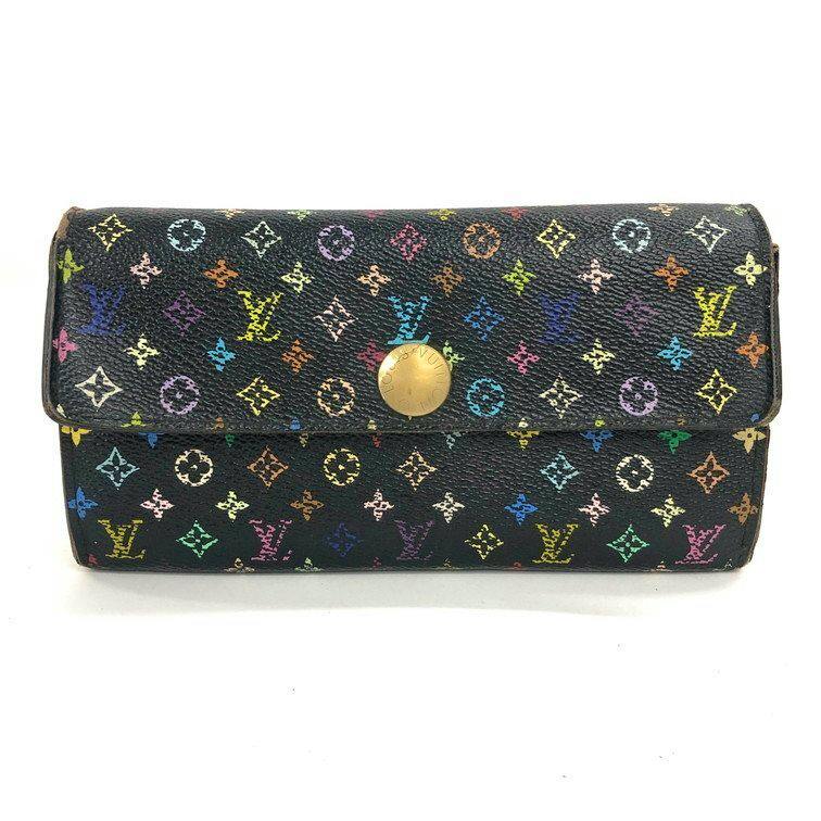 Front view of a black Louis Vuitton multicolor monogram wallet with a centered gold snap closure.