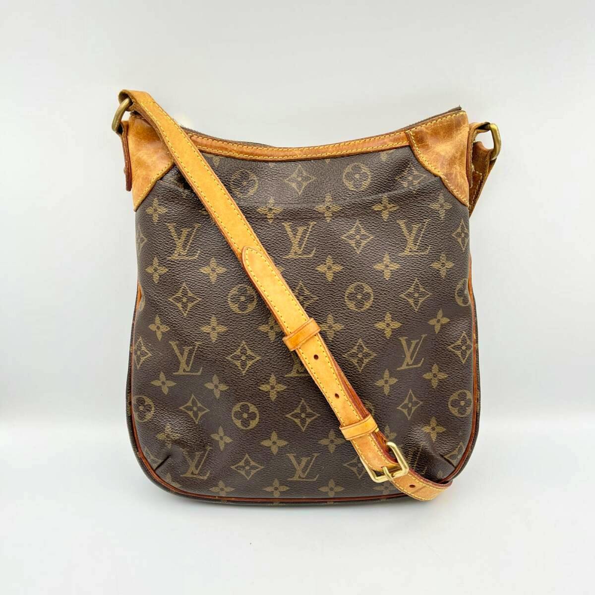 Front view of the Louis Vuitton Monogram Canvas Odeon PM shoulder bag showing the monogram canvas, leather trim, and adjustable strap.