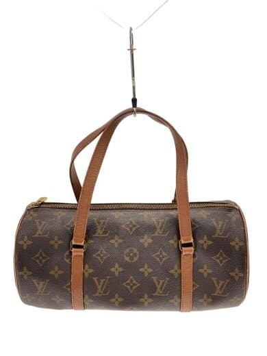 Brown monogram canvas cylindrical Papillon handbag with two leather handles hanging from a hook.