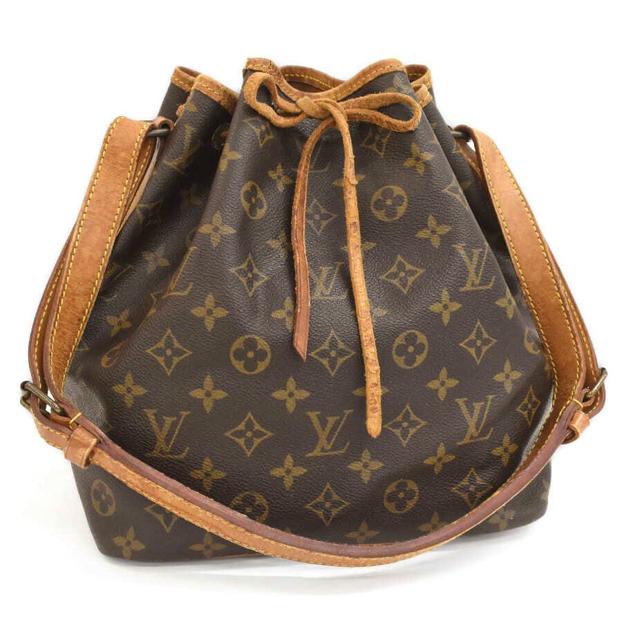 Front view of a LOUIS VUITTON Petit Noé (M42226) monogram canvas shoulder bag with brown leather trim and drawstring closure.