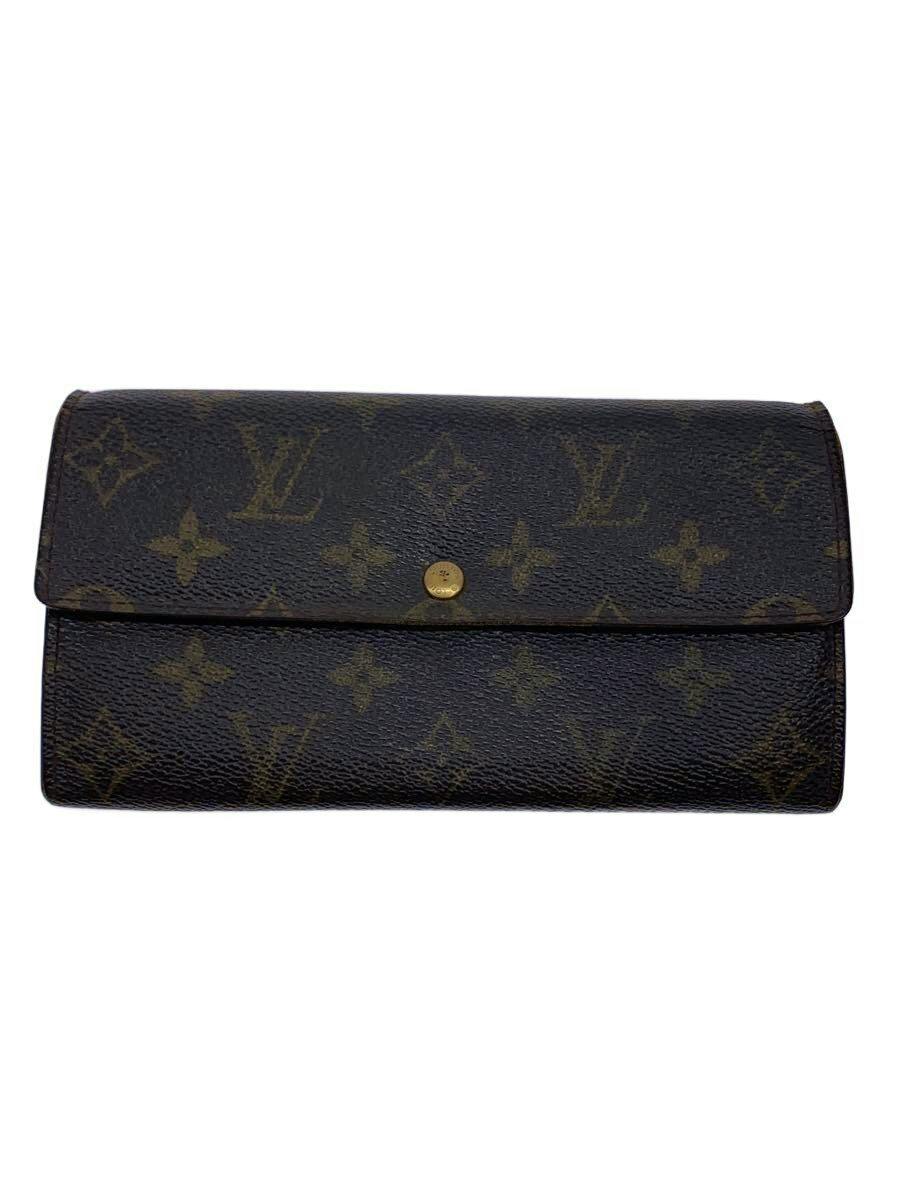 Front view of a brown Louis Vuitton monogram canvas wallet with a flap and central gold snap button.