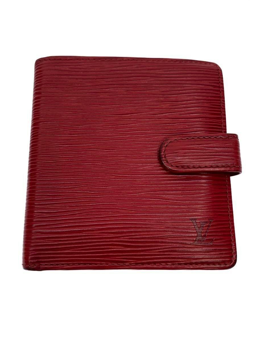 Red Louis Vuitton Epi leather compact wallet shown closed with a tab closure and embossed LV logo on the front.