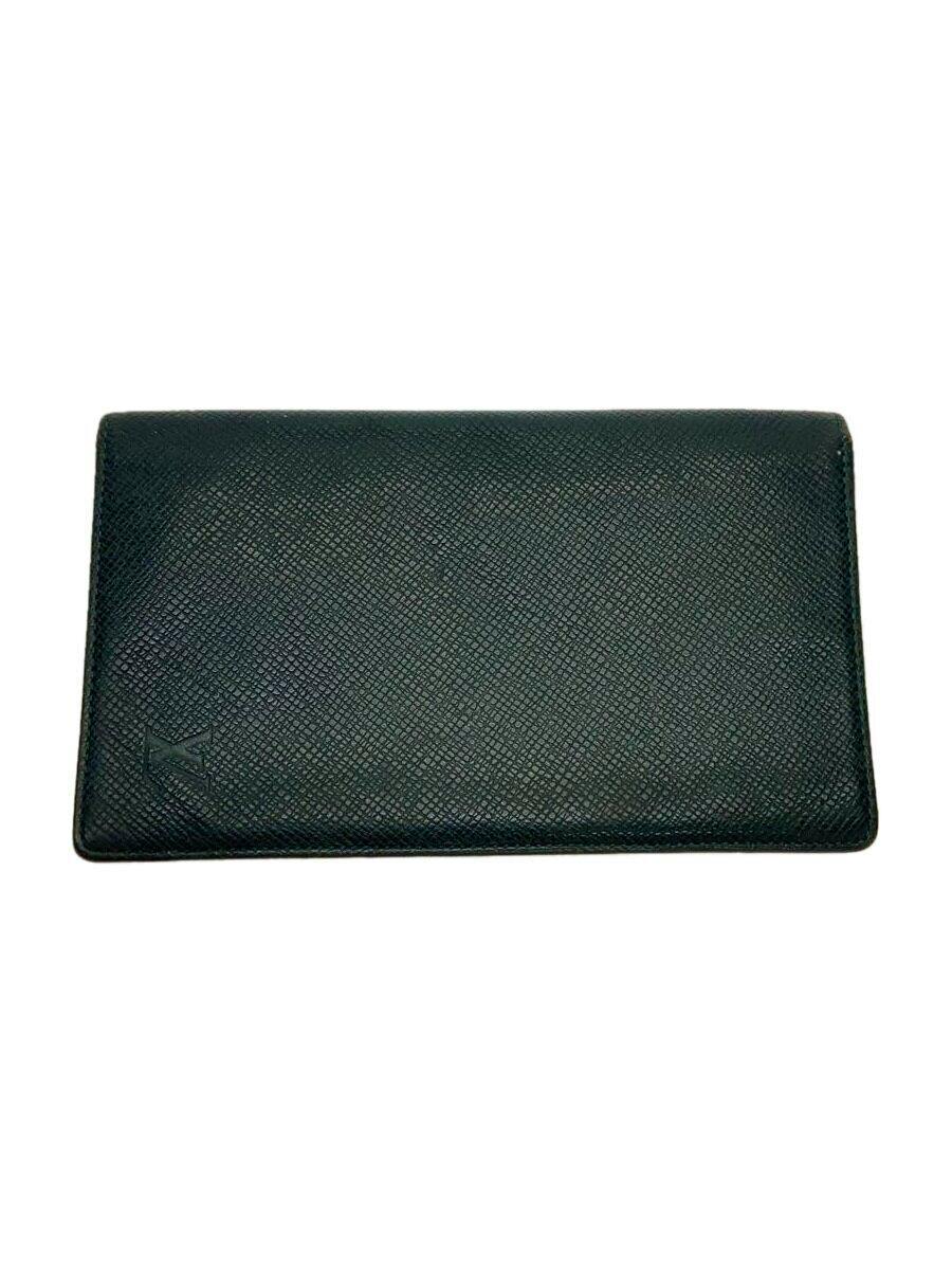 Green Louis Vuitton men's leather card wallet exterior on a white background showing textured leather and an embossed LV logo.