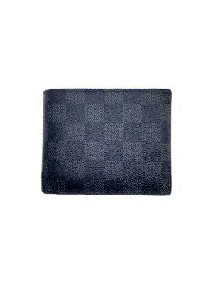 Closed black Damier Graphite Louis Vuitton bi-fold wallet shown front-facing.
