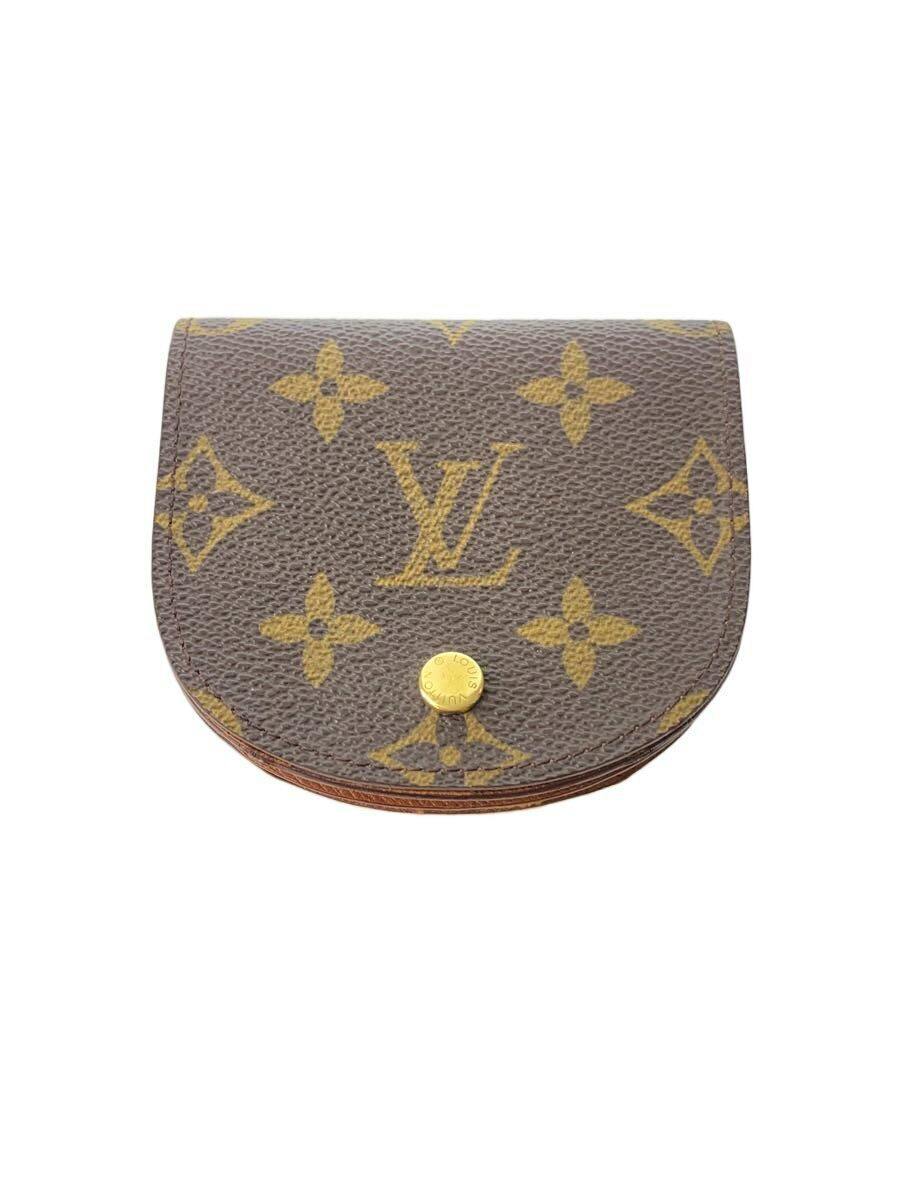 Brown Louis Vuitton monogram canvas round-flap coin wallet shown closed with a gold snap button.
