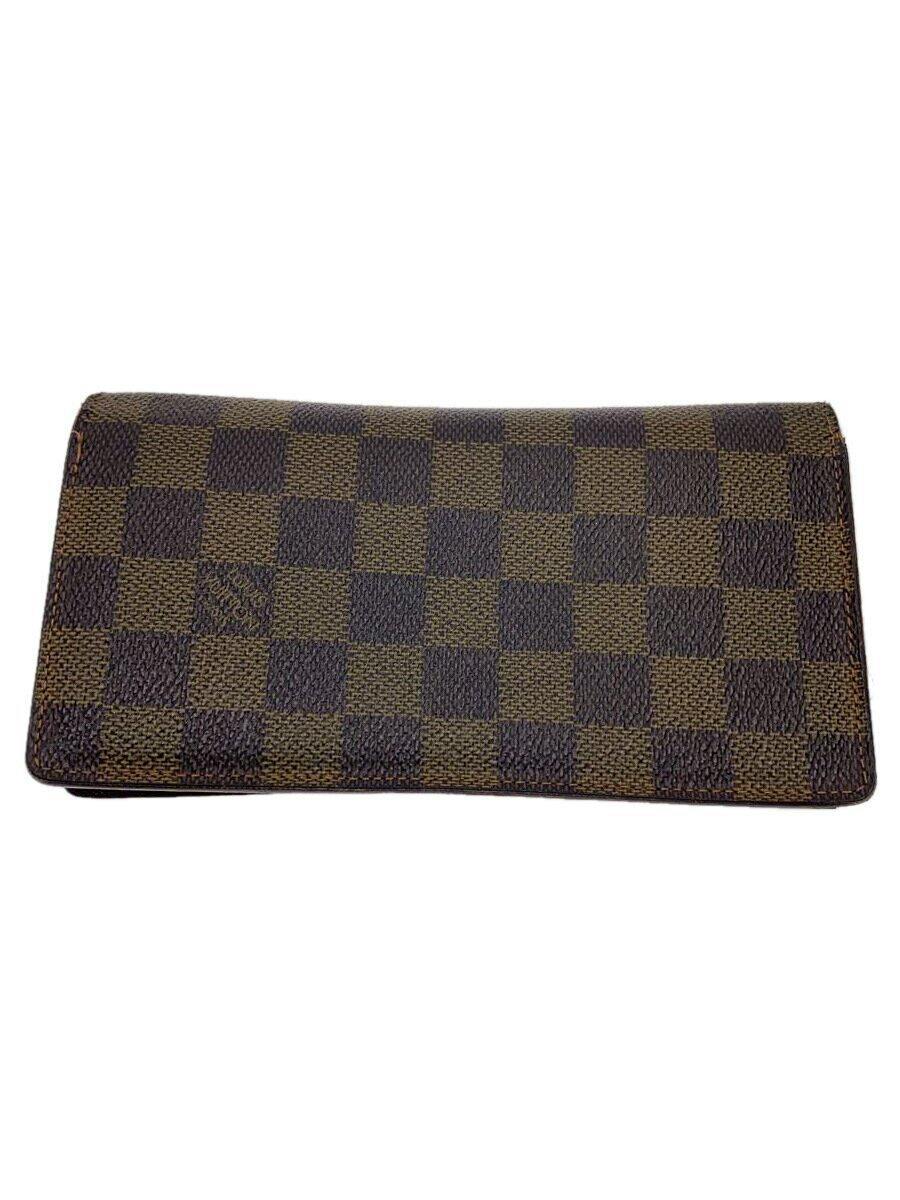Brown Damier Ebene Louis Vuitton wallet laid flat showing the exterior pattern.