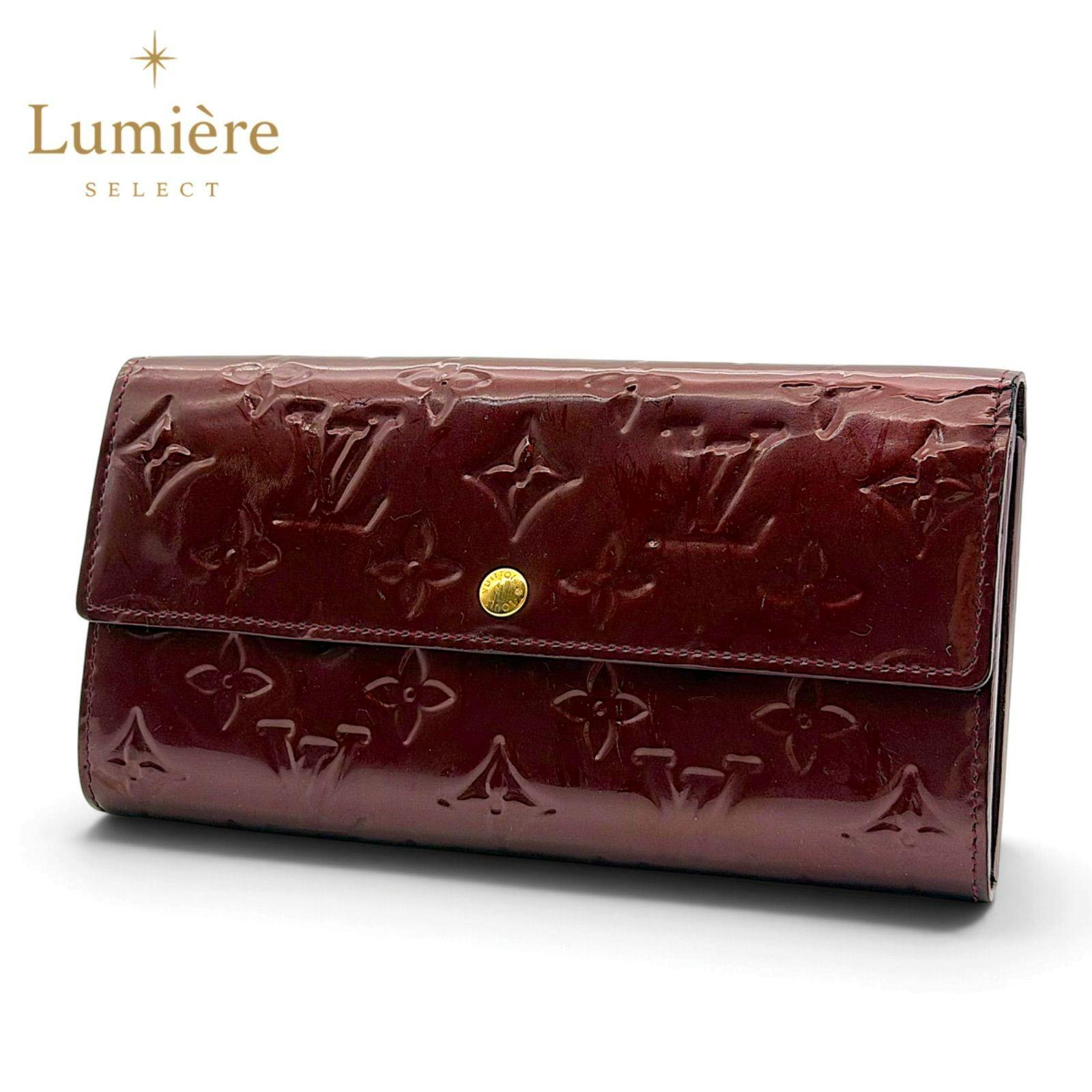 Front view of the Louis Vuitton Portefeuille Sarah monogram Vernis amarante patent leather flap wallet showing embossed monogram pattern and gold snap closure.